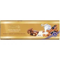 Шоколад молочний Lindt Gold Tablets з родзинками та горішками 300 г