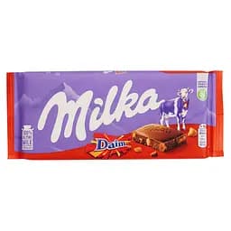 Шоколад молочний Milka з шматочками карамелі з мигдалем 100 г