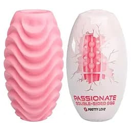 Яйце-мастурбатор текстуроване двостороннє силікон чоловічий аксесуар компактний рожевий