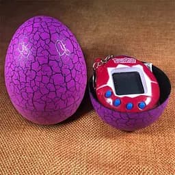 Іграшка-електронний вихованець UFT Eggshell Game Purple Тамагочі в яйці динозавра фіолетова - мініатюра 2