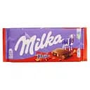 Шоколад молочний Milka з шматочками карамелі з мигдалем 100 г